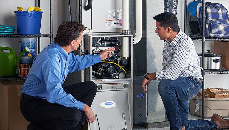 Technician diagnosing furnace with AI software
